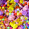 Mistery Charms da Ollie em várias cores e formas, perfeitos para colecionadores e personalizar looks.